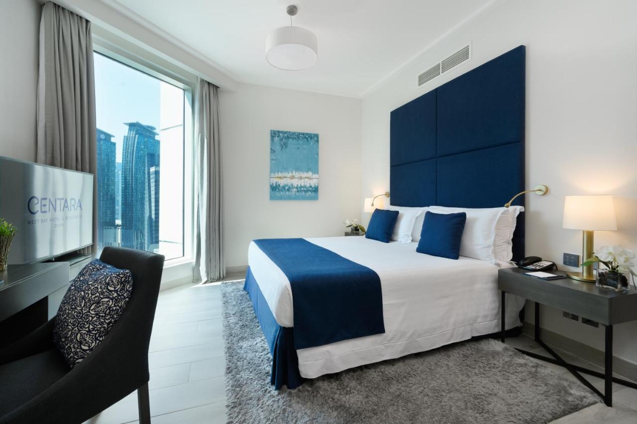 Centara West Bay Hotel & Residences 도하 외부 사진 A bedroom at the Address Downtown Hotel