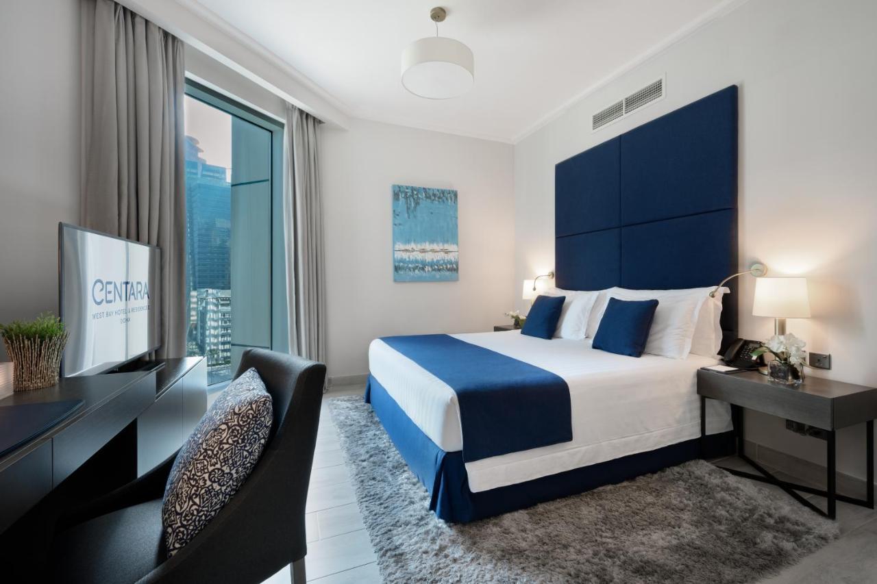 Centara West Bay Hotel & Residences 도하 외부 사진 A bedroom at the Address Downtown Hotel